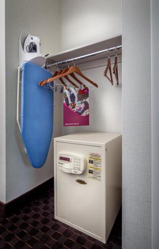 a small refrigerator with a phone in a room at Crowne Plaza Phoenix Airport - PHX by IHG in Phoenix