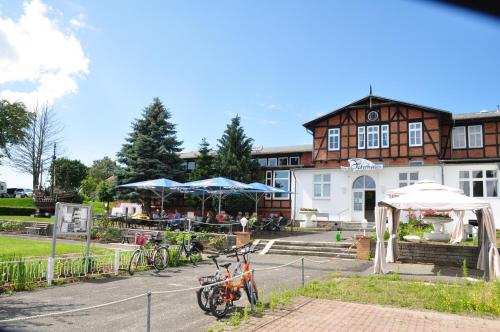 a group of bikes parked in front of a building at Pension Zum Alten Fährhaus in Rostock