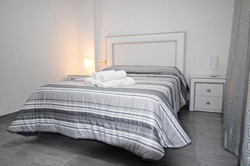 Posteľ alebo postele v izbe v ubytovaní Apartamento Completo Lonja Centro
