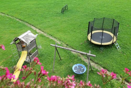 an overhead view of a playground with a play structure and a slide at Bauernhof Trinkergut in Unternberg