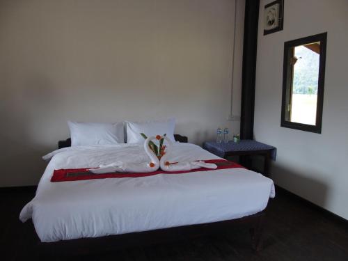 Katil atau katil-katil dalam bilik di Thongdam Guesthouse
