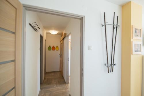 a hallway with a door leading into a room at Apartmány Lea in Liptovský Mikuláš