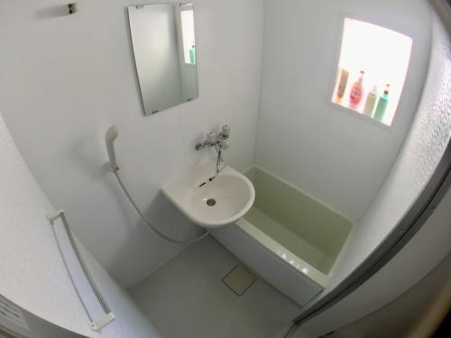 Salle de bains dans l'établissement Izumi Apartment