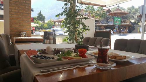 a table with a tray of food on a table at Han Deluxe Hotel in Oludeniz
