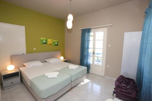 a bedroom with a bed with two towels on it at Blue Sky in Galissas