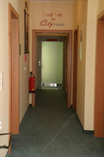 a hallway of a building with a sign that reads my golf inn city hotel at City Hotel Neunkirchen in Neunkirchen