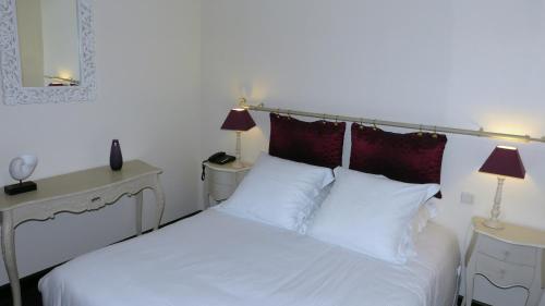 Cama o camas de una habitación en Le Pave d'Hotes