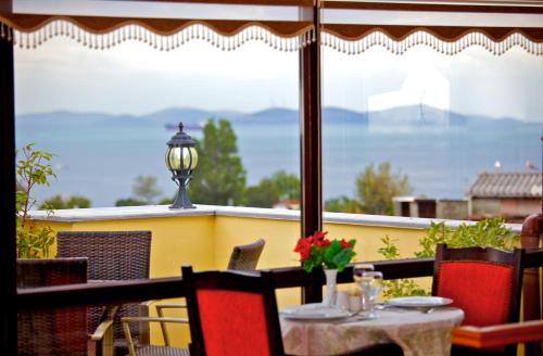 a table and chairs on a balcony with a view at Amber Hotel & Spa in Istanbul