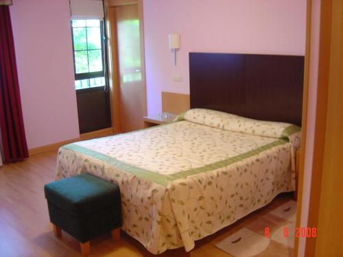 Cama o camas de una habitación en Hotel Alisa