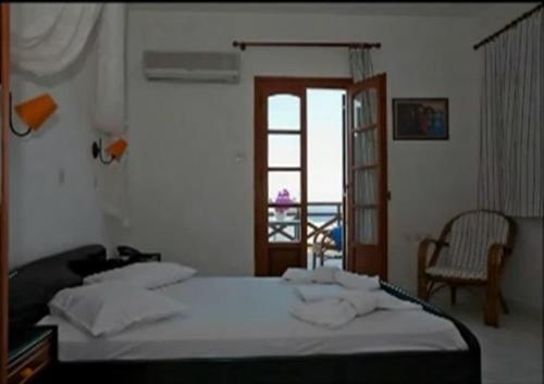 Ένα ή περισσότερα κρεβάτια σε δωμάτιο στο Azolimnos Bay