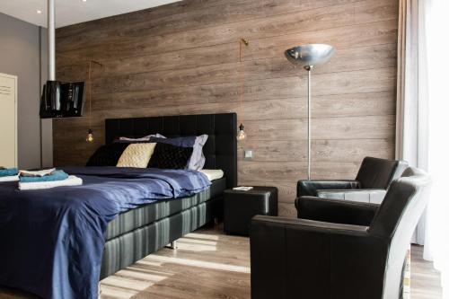 Giường trong phòng chung tại Luxe B&B Het Colmerhof
