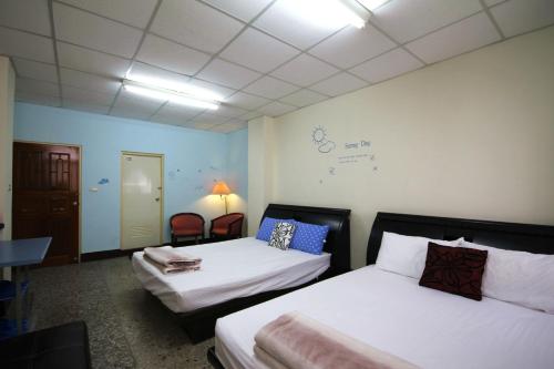 A bed or beds in a room at Kite Hostel