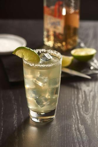 a drink with a lime on a table at Hyatt Place Denver-South/Park Meadows in Lone Tree