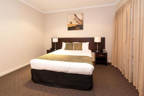Frome Apartmentsにあるベッド