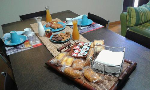 a table with food and plates of food on it at ARAS b&b - in Mazzarino