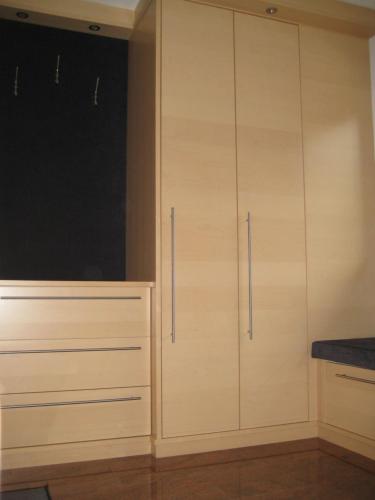 a kitchen with white cabinets and a window at Appartement Ronacher in Mittersill