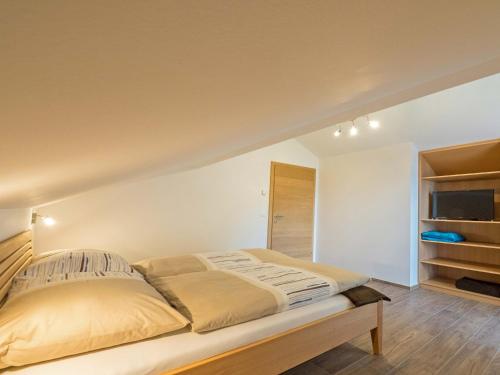 Cama ou camas em um quarto em Appartement Lackner mit Seeblick