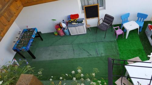 a view of a room with a table and chairs at Cèsa Chri e Sofì in Campitello di Fassa