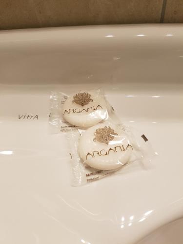 two food items in plastic bags on a table at Foresteria Villa Margherita in Colico