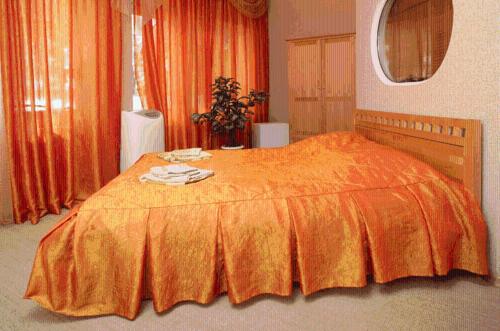 Кровать или кровати в номере Atpūtas komplekss Lilaste