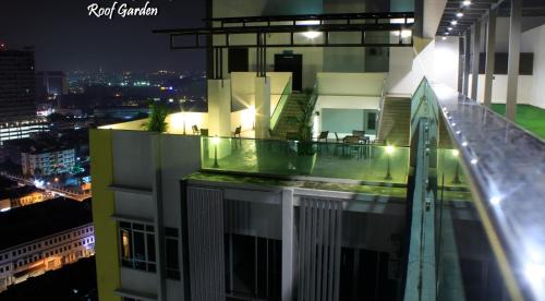 a balcony of a building at night at H2H - Euro House @ Majestic Ipoh (8~10 Guests) in Ipoh