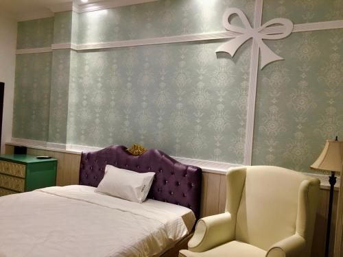 Ein Bett oder Betten in einem Zimmer der Unterkunft Jing Lai Hui Lan Homestay