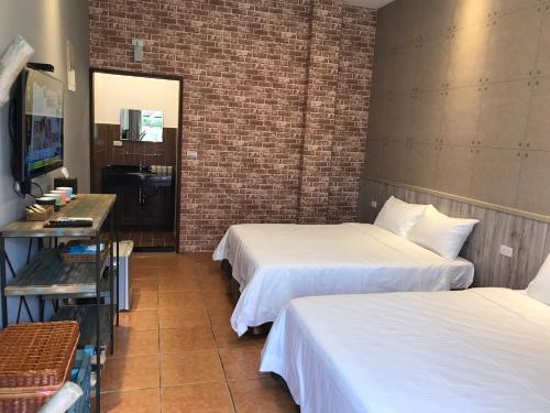 Ein Bett oder Betten in einem Zimmer der Unterkunft Jing Lai Hui Lan Homestay