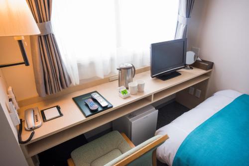 TV/Unterhaltungsangebot in der Unterkunft Tomakomai Hotel Sugita