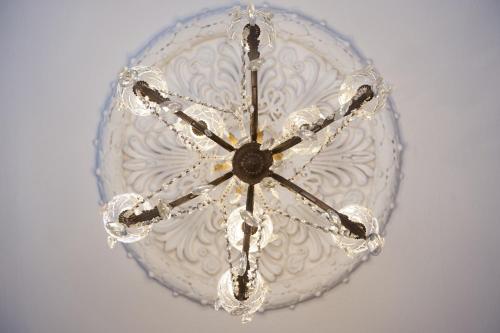 a chandelier is hanging from a ceiling at No11 Boutique Hotel & Brasserie in Edinburgh