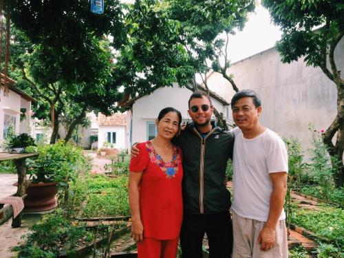 a group of three people posing for a picture at Vietnam Phuot Real Home in Kon Tum