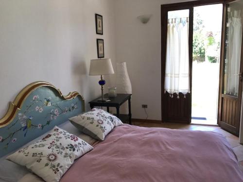 Ένα ή περισσότερα κρεβάτια σε δωμάτιο στο Villa Poggio San Pietro