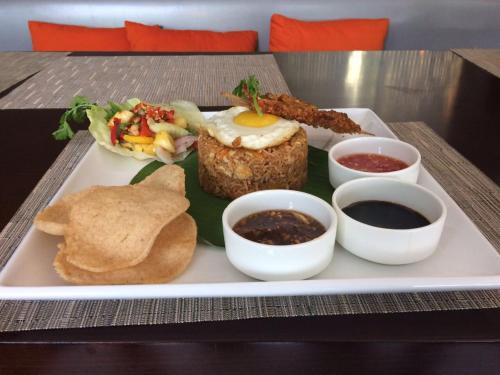 a plate of food on a table with a plate of food at Fortune Park Sishmo, Bhubaneswar - Member ITC Hotels' Group in Bhubaneshwar