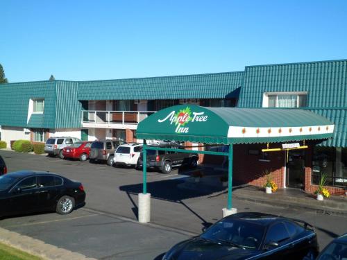 a parking lot with a krispy kreme inn at Apple Tree Inn in Spokane