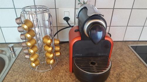 a toaster sitting on a counter next to a sink at Ferienwohnung Eisenring in idyllischer Umgebung in Gähwil