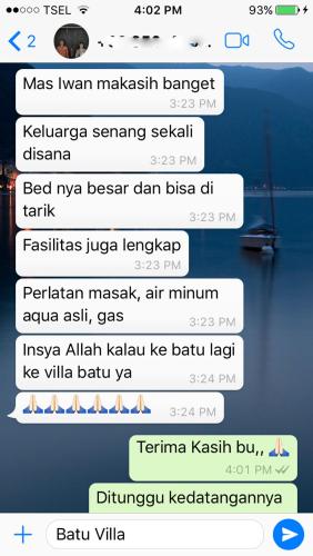 a screenshot of a text message about a boat at Villa Ohana Batu in Batu