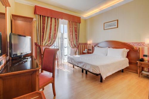 Giường trong phòng chung tại Hotel San Donato - Bologna centro