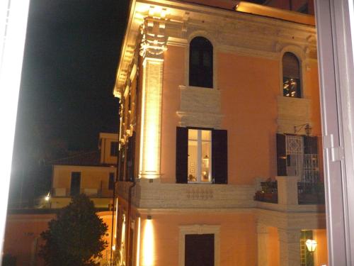 a building with lights on it at night at My Bed Vatican Museum in Rome