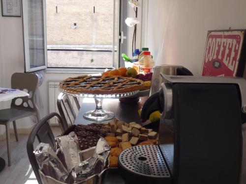 a table with a tray of different types of food at My Bed Vatican Museum in Rome