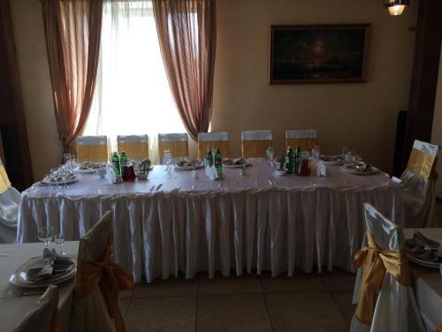 a table set up for a wedding in a room at Hotel Grant in Kharkiv