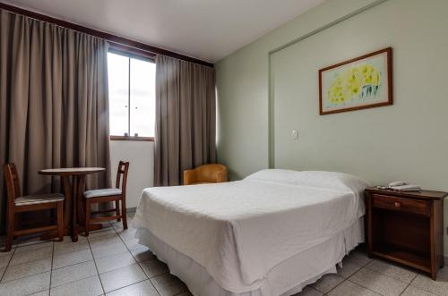 Katil atau katil-katil dalam bilik di Hotel Coquille