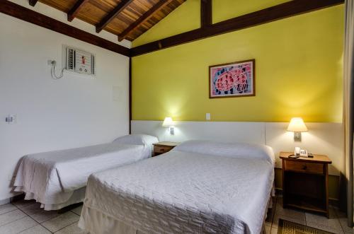 Katil atau katil-katil dalam bilik di Hotel Coquille