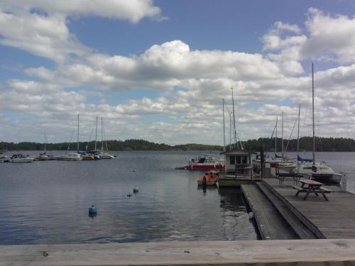 a dock with boats docked in the water at Tofvehults Boende in Skaftet