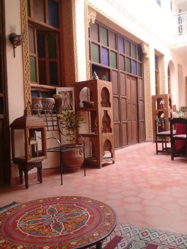 a room with wooden doors and a rug on a floor at dar wassim el ghali in Rabat