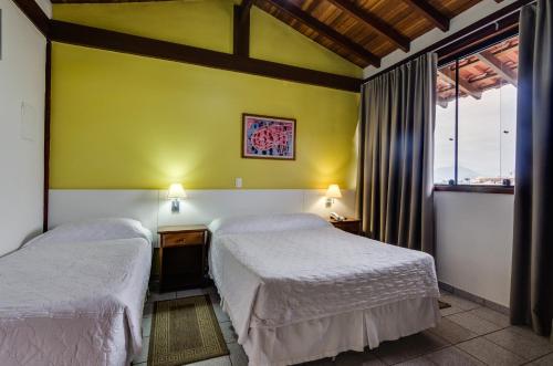 Katil atau katil-katil dalam bilik di Hotel Coquille