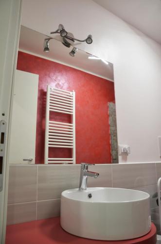a bathroom with a sink and a mirror at La Tana Delle Lepri in Morolo