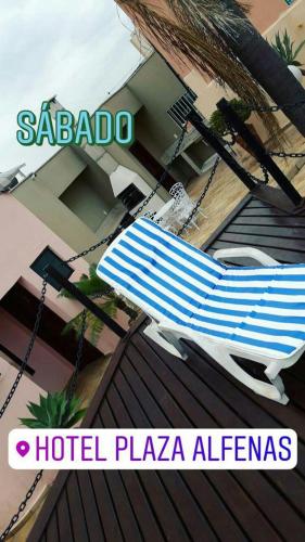 a hammock on the roof of a house at Hotel Plaza Inn Flat Residence in Alfenas