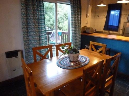 a wooden table in a kitchen with a dining room at Aguamansa in Las Gaviotas
