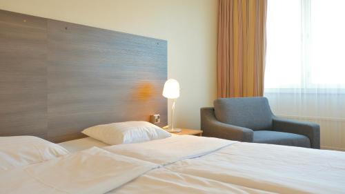 Postel nebo postele na pokoji v ubytování Torget Aparthotel