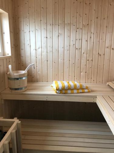 a sauna with two pillows on a wooden shelf at Goitzsche Resort in Bitterfeld