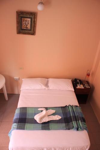 Hostal La Posada De Jose Carlosにあるベッド